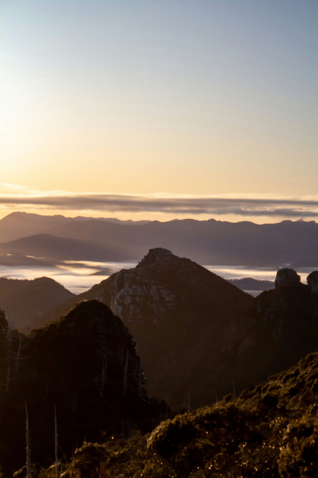 Sunrise over the Hartz Mountains and mist-filled valleys in southern Tasmania